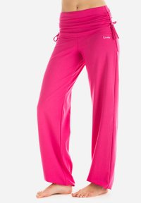 Roze, lichte, wijde broek met een gerimpelde, elastische tailleband en trekkoorden. Gladde textuur en ontspannen pasvorm.