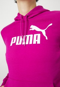 Puma LOGO HOODIE - Kapucnis pulóver - magenta gleam