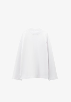 Felpa bianca oversize con scollo rotondo, maniche lunghe e tessuto morbido e liscio. Presenta spalle scese e orlo dritto.