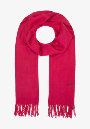 Jasnoróżowy wełniany szalik z frędzlami na końcach, luźno owinięty na środku, z małą prostokątną metką marki z jednej strony.