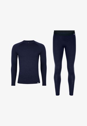 Haut à manches longues bleu marine et leggings assortis en tissu doux et texturé. Comprend un col rond et une ceinture élastique sur les leggings.