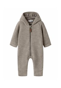 Combinaison en coton gris avec capuche, fermeture éclair sur toute la longueur à l'avant, manches longues et poignets côtelés. Texture douce et design minimal.
