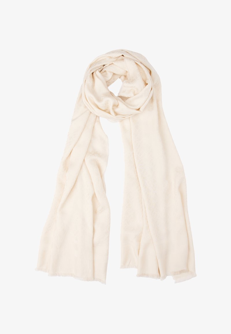 Écharpe crème en tissu doux, avec un motif subtil, des bords arrondis et des franges légères aux extrémités. Design long et rectangulaire.
