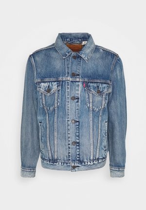Veste en jean bleue à boutons sur le devant, deux poches poitrine à rabat et poches latérales, avec un col classique et un effet délavé.