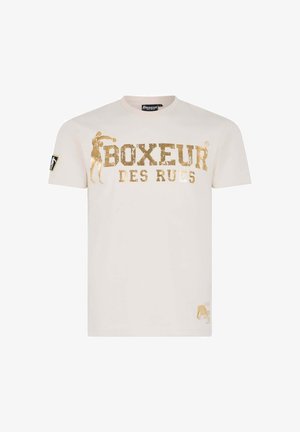 T-shirt crema a maniche corte con testo audace in oro "Boxeur des Rues" e una silhouette di pugilato; include una toppa logo sulla manica sinistra.
