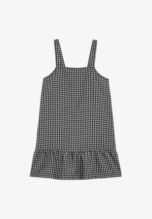 Kratka haljina bez rukava u crno-bijelom kariranom uzorku, sa volanima na rubu i tankim naramenicama. Pamuk.