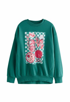 Hanorac verde cu o imprimare grafică a alimentelor pe un fundal pătrat. Material moale, cu un design relaxat și mansete cu model de jantă.