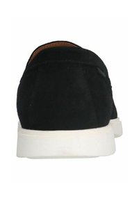Black suede shoes with a white sole, showcasing a rounded back shape and minimalistic design. No prominent accents or patterns.
