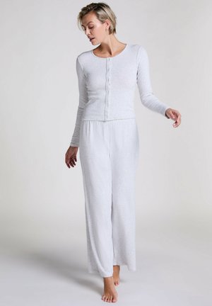 Light gray loungewear set features a long-sleeve button-up top and wide-leg pants, made of soft, textured fabric for comfort.