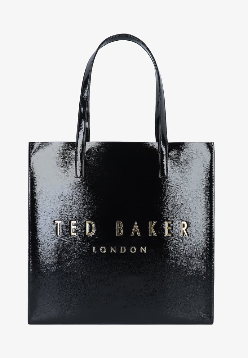 Čierna lakovaná kožená taška s pevným tvarom, dvoma uchami a zlatým embosovaným textom loga: "TED BAKER LONDON."