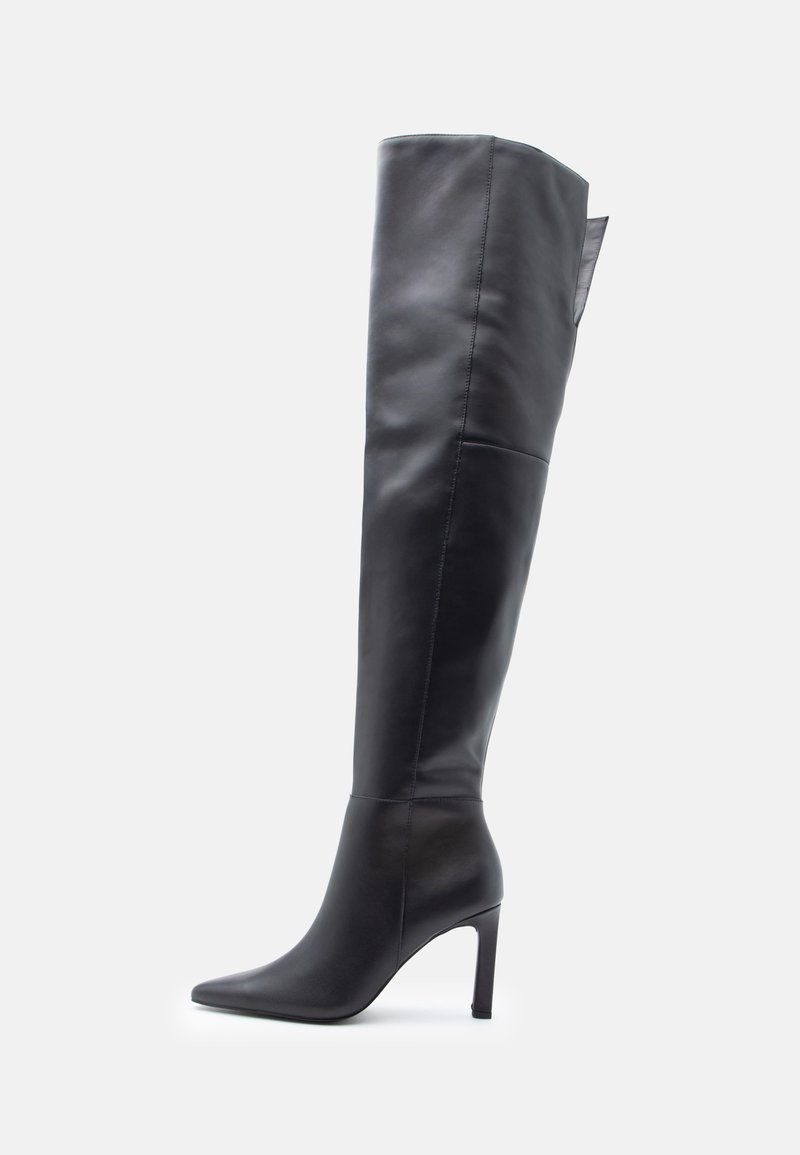 Black thigh-high leather boot with pointed toe and stiletto heel on a white background, facing left.