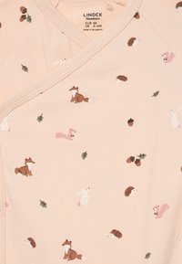 Newborn size 4-6 months pale pink baby wrap top with woodland animals and acorn patterns, including fox, squirrel, hedgehog, and rabbit.