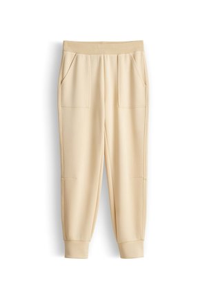 Beige casual joggerbroek met elastische tailleband, twee voorzakken en gerafelde enkels.