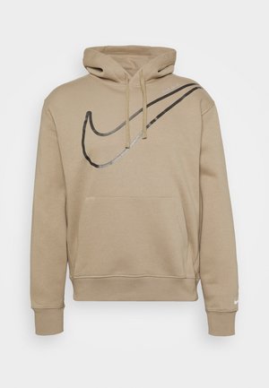 Beżowa bluza z kapturem z dużym czarnym logo Nike na piersi, kieszenią kangurką, sznurkiem przy kapturze oraz małym białym logo na lewym mankiecie.