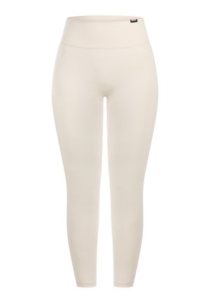 Leggings beige con cintura alta, hechos de tela elástica. Textura lisa sin patrones ni adornos, diseñados para un ajuste ceñido.