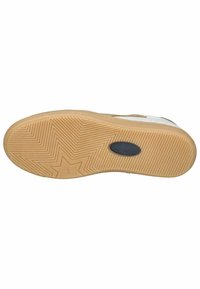 Sole of a sneaker, featuring a textured gum rubber design with a star pattern, curved shape, and a central logo accent.