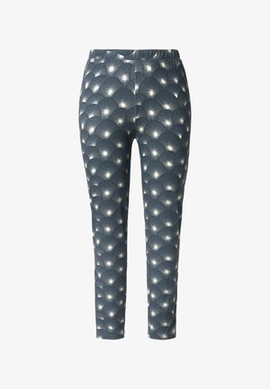 Leggings con una tela texturizada azul que presenta un patrón repetitivo de abanicos en blanco. Cintura elástica y ajuste tapered.