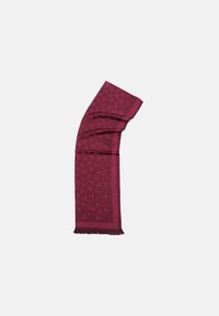 Bordeaux-farvet tørklæde med et struktureret mønster, frynser i kanten og et glat materiale med en subtil glans. Designet inkluderer cirkulære motiver.