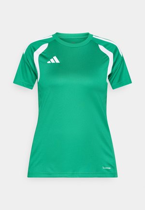Zelena sportska majica od prozračnog materijala. Ima bijele naglaske na ramenima i Adidas logo na prsima. Kratki rukavi.