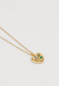 Gold heart-shaped pendant necklace featuring multi-colored gemstones in various shapes, attached to a delicate chain.