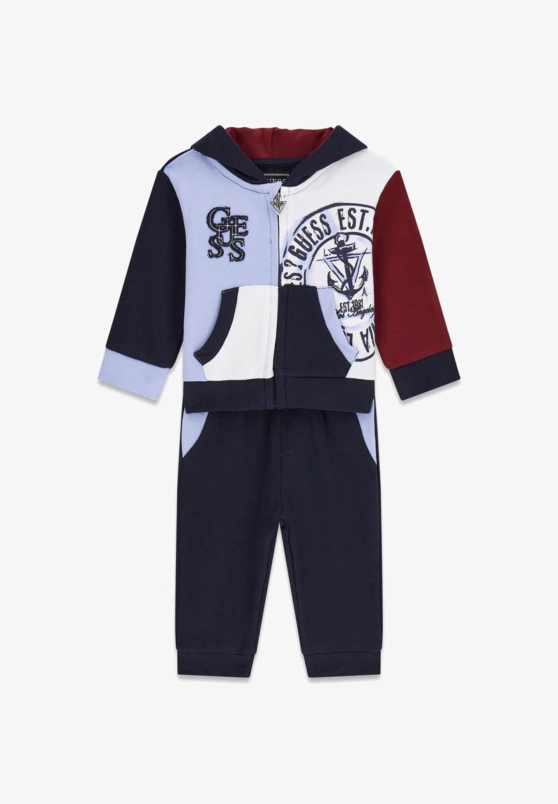 Puuvillane värviplokkidega dressipluus, mis sisaldab tumesinist, helesinist, burgundiat ja valgeid osi. Kapuutsiga lukuga jakk esiteks taskutega ja logode detailidega.