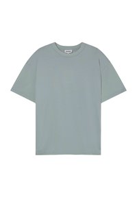 Jasnozielona bawełniana koszulka o luźnym kroju, z krótkimi rękawami i okrągłym dekoltem. Gładka faktura, bez widocznych wzorów czy akcentów.