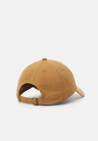 Brown corduroy baseball cap with a curved brim, adjustable strap at the back, and eight stitching patterns on the crown.