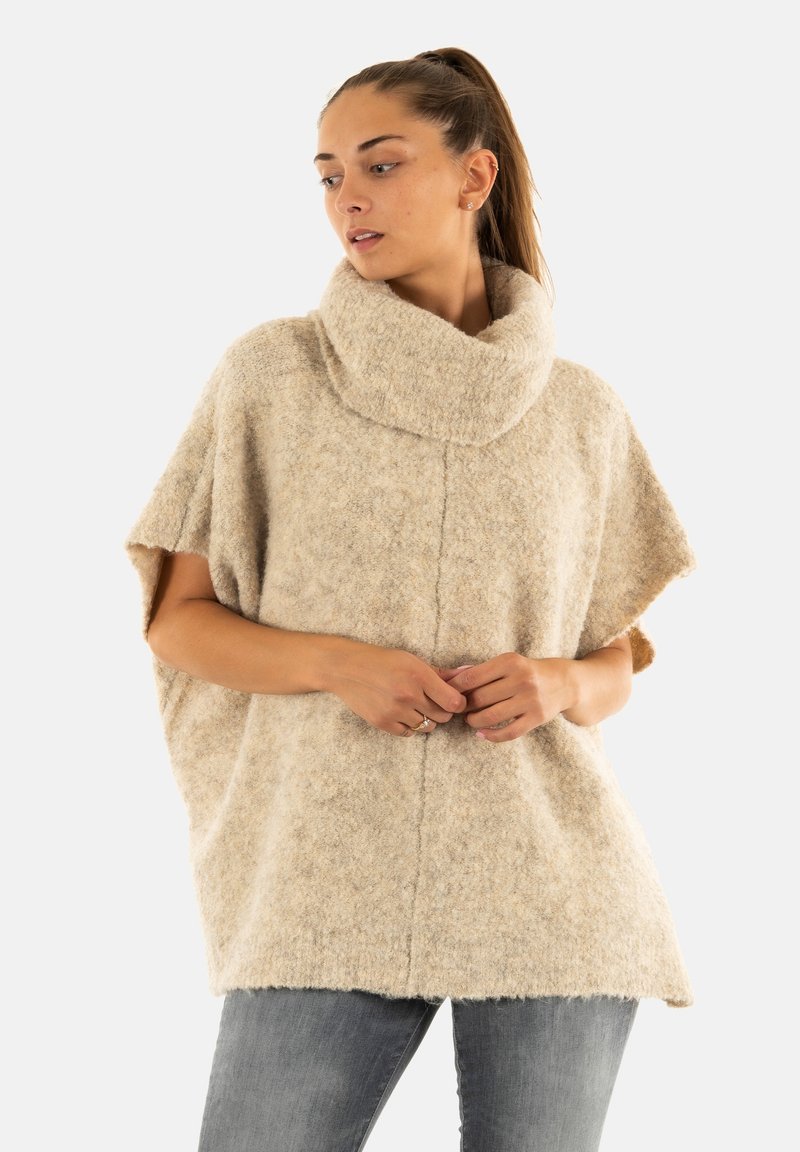 Lichtbeige wollen poncho met een grote col, korte mouwen, een losse pasvorm en een gestructureerd oppervlak. Kenmerkt zich door een centrale naad en een zachte afwerking.