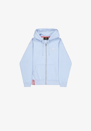 Vaaleansininen vetoketjuhuppari, joka on valmistettu pehmeästä kankaasta. Siinä on etuvetoketju, kaksi taskua ja pieni logo yksityiskohtana rinnassa.