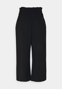 Pantalon noir court avec une taille froncée. Tissu doux, coupe à jambes larges et texture lisse, idéal pour un port décontracté ou relax.