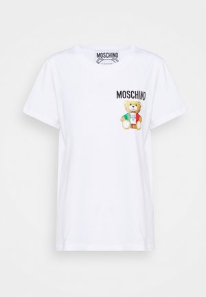 White short-sleeve T-shirt with a small teddy bear graphic and "MOSCHINO" text on the upper left chest area