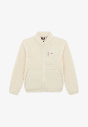 Giacca in fleece color crema con colletto alto, zip frontale, due tasche laterali e una tasca sul petto. Tessuto morbido e testurizzato.