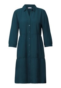 Robe chemise en coton teal avec col, devant boutonné, manches trois-quarts et jupe à volants. Texture douce et style décontracté.