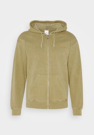 Beżowa bluza z polaru z kapturem na suwak, przednimi kieszeniami, regulowanym sznurkiem w kapturze oraz małym pomarańczowym napisem na lewej piersi "lois jeans".