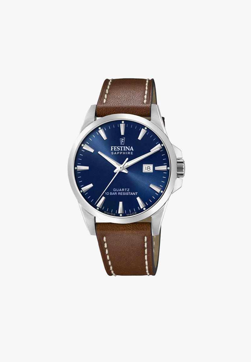 Quarzuhr mit blauem Zifferblatt, silberner Lünette und braunem Lederarmband, ausgestattet mit weißen Stundenmarkierungen und Datumsfenster. 10 bar Wasserdichtigkeit.
