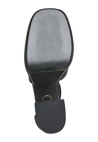 Sole of a black low-heeled shoe with ribbed grip pattern on heel and ball area for better traction.