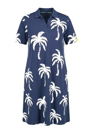 Granatowa sukienka polo z krótkimi rękawami, z białymi nadrukami palmy i małą żółtą metką na lewym rękawie.