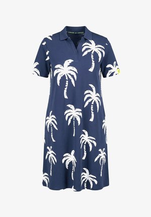 Granatowa sukienka polo z krótkimi rękawami, z białymi nadrukami palmy i małą żółtą metką na lewym rękawie.