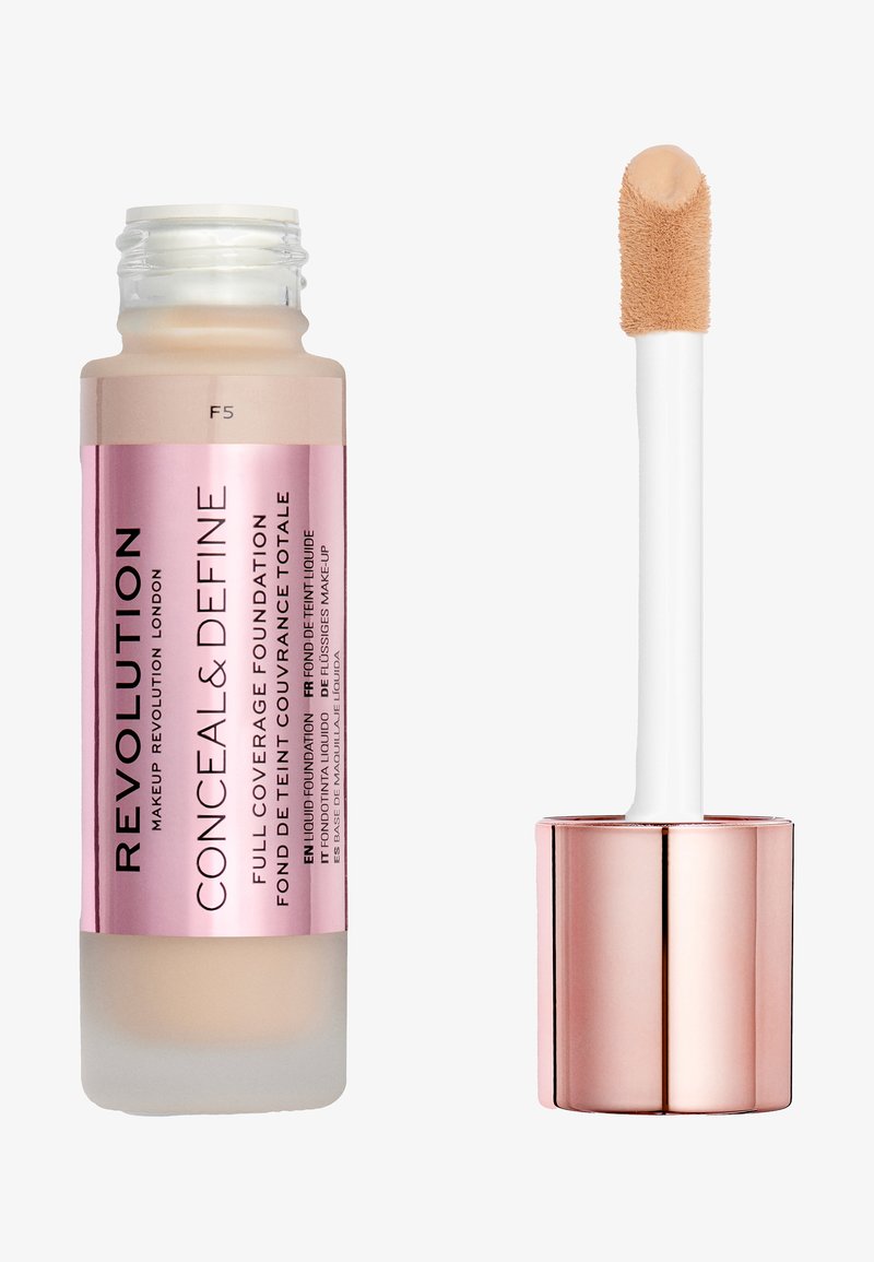 Revolution Conceal & Define foundation in a frosted bottle with a pink label. Features a white applicator with a rounded tip. Color F5.