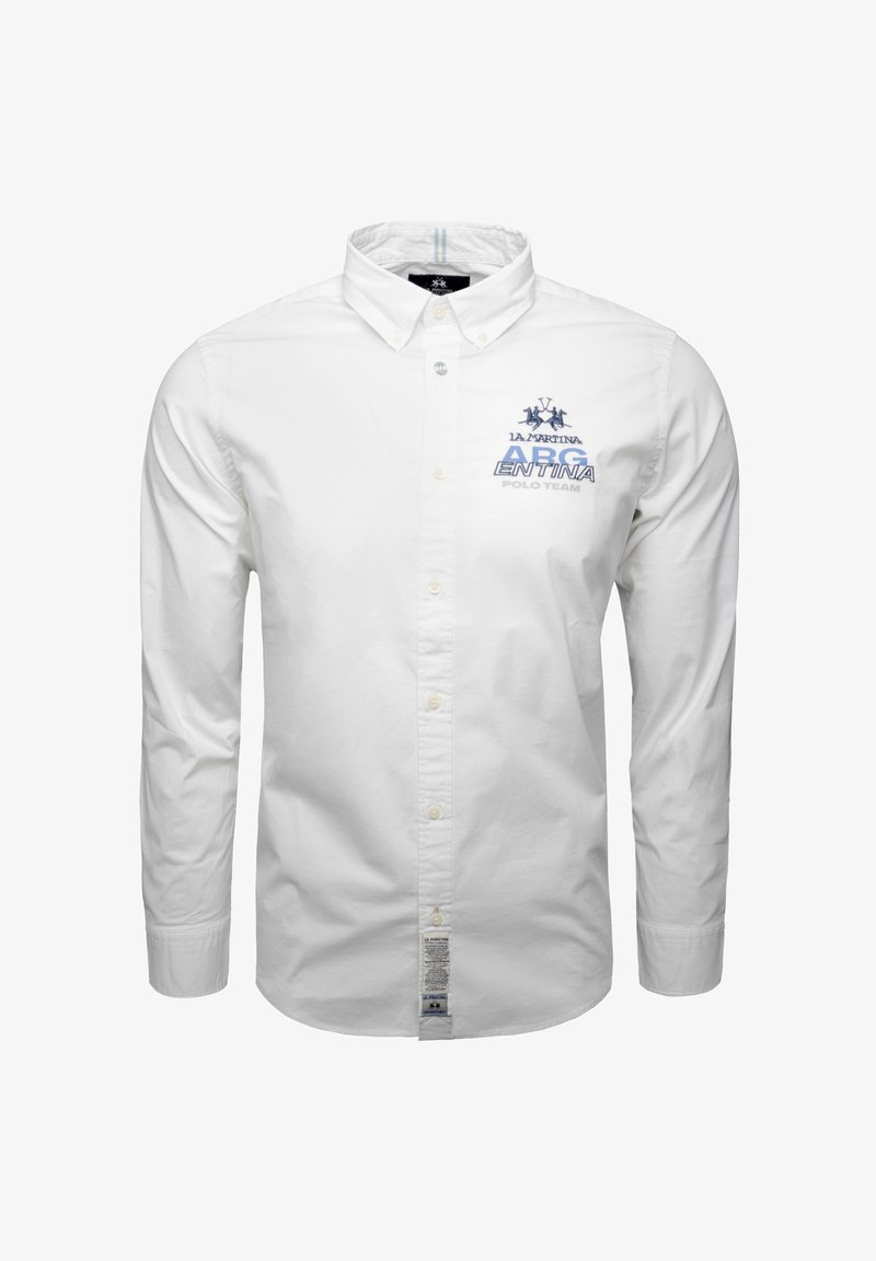 Camicia bianca a maniche lunghe con colletto button-down, con logo ricamato blu e testo "ARGENTINA POLO TEAM" sul lato sinistro del petto.