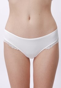 White bikini-style panties made of smooth fabric, featuring lace trim along the edges, with a soft texture and minimalistic design.