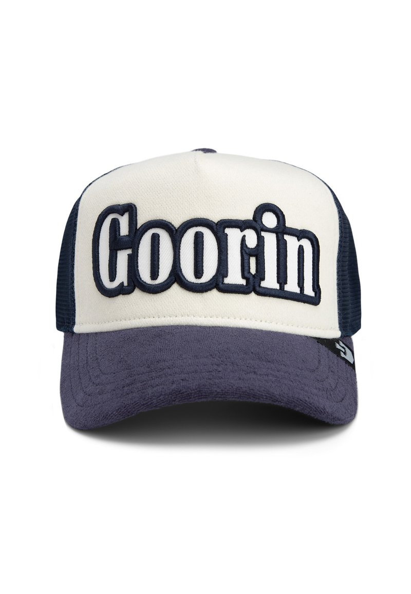 Trucker cap featuring a beige front, navy mesh sides, and a dark blue brim. "Goorin" embroidered prominently on the front in white and navy.