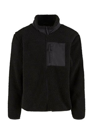 Schwarze Fleecejacke mit strukturierten Oberflächen, hohem Kragen und einer Reißverschlusstasche auf der Brust aus glattem schwarzem Material. Durchgehender Reißverschluss auf der Vorderseite.