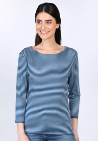 Gestreiftes Langarmoberteil in Blau und Hellblau mit weitem Ausschnitt und gewelltem Saum. Weicher, leichter Stoff mit einer lockeren Passform.