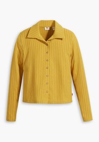 Gul, randig, långärmad skjorta med knappar och krage samt pärlemorliknande knappar, med textilstruktur och kortad design.