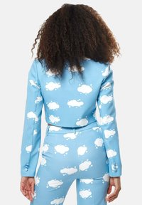Cropped blue jacket and matching pants, both featuring white cloud patterns, smooth texture, long sleeves, and fitted silhouette.