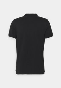 T-shirt polo noir à manches courtes, avec un col classique et une texture lisse. Pas de motifs ou de dessins visibles. Vue de dos montrée.