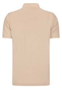Polo shirt beige à manches courtes en coton. Doté d'un col et d'un tissu texturé et lisse. Aucuns logos ou motifs visibles.