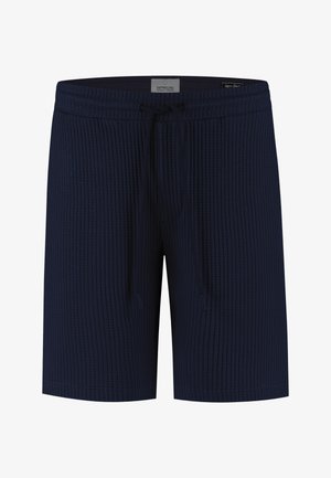 Shorts in maglia strutturata blu navy con cintura elastica e coulisse regolabile, con etichetta "Dstrezzed" all'interno della cintura.