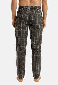 Groene geruite broek met een elastische tailleband, voorzien van een ruitpatroon in blauw en wit. Lichtgewicht stof en recht gesneden ontwerp.